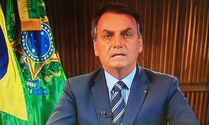 Foto do ex-presidente Bolsonaro, acusado de genocida.